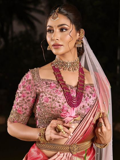 A close-up of the soft, romantic makeup from our portfolio shoot. The pink tones in the makeup and saree create a harmonious and elegant look.