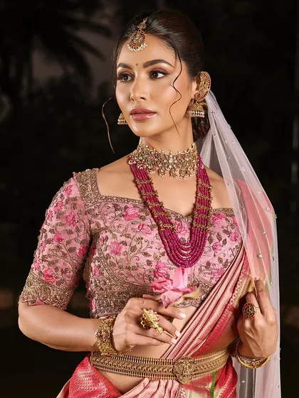 A close-up of the soft, romantic makeup from our portfolio shoot. The pink tones in the makeup and saree create a harmonious and elegant look.