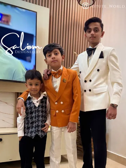 I also create custom formal wear for the youngest members of the family. Here are three young gentlemen in their own made-to-measure outfits, including a double-breasted tuxedo and a stylish waistcoat set.