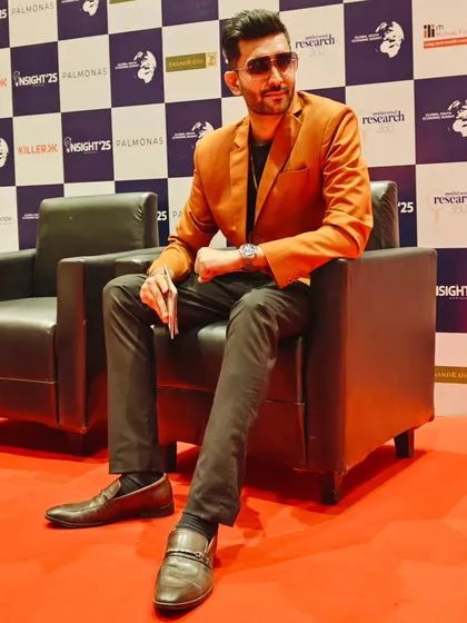 A confident pose before hosting the summit. My style is an extension of my personality: polished, sharp, and ready for action.