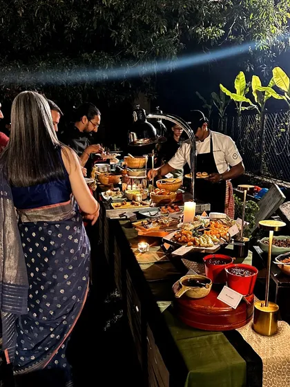 No kitchen? No problem. Here is my team serving guests at a multi-cuisine buffet set against the stunning ruins of Hampi, proving that I can create an exceptional culinary experience anywhere in the world.