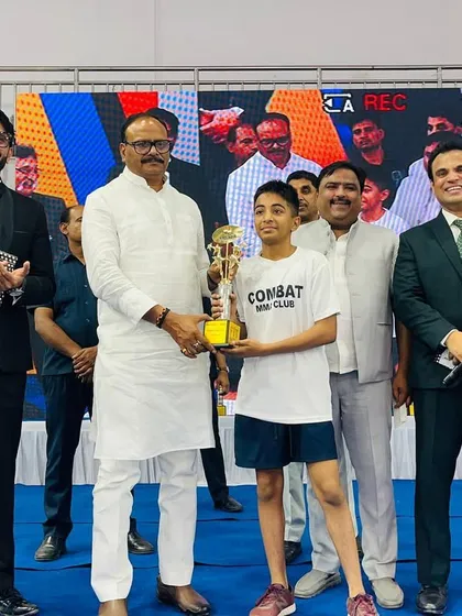 One of our students, Devan, receiving the Best Fighter award in the youth division at a national event. Individual achievements like this are a testament to a fighter's personal dedication and skill.