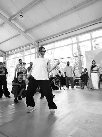 A black and white shot from the battles at Spectra, capturing the focus and flow of a dancer in the zone. The energy in the cypher is always electric.