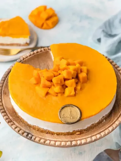 Our classic Mango Cheesecake, topped with a thick layer of fresh homemade mango puree and garnished with freshly cut mango cubes. It's pure, simple, and delicious.