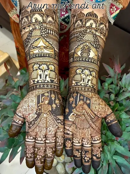A grand and royal design featuring bride and groom portraits, elephants, and palace architecture.