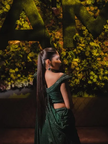 The sleek, high ponytail is the perfect hairstyle for this modern and chic cocktail look.