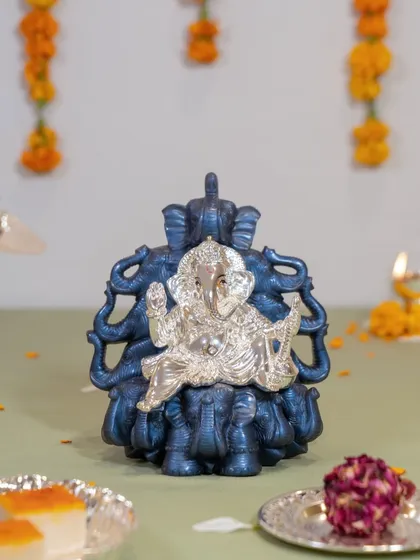 Another view of the majestic Ganesha on an elephant throne. This piece is perfect for those who appreciate symbolic art and want to make a bold statement of faith in their decor.
