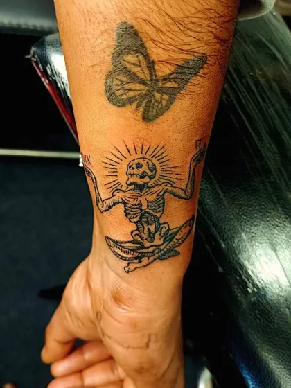 A unique and thought-provoking tattoo of a meditating skeleton. This piece symbolizes peace and acceptance, finding tranquility even in mortality.