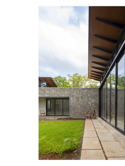 The 'Villa in a Grove' in Zirard, Alibaug. The sense of place is key. This home embraces the grove it occupies, delivering an alfresco living space under the tree canopies.