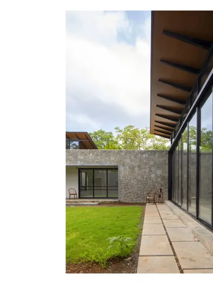 The 'Villa in a Grove' in Zirard, Alibaug. The sense of place is key. This home embraces the grove it occupies, delivering an alfresco living space under the tree canopies.