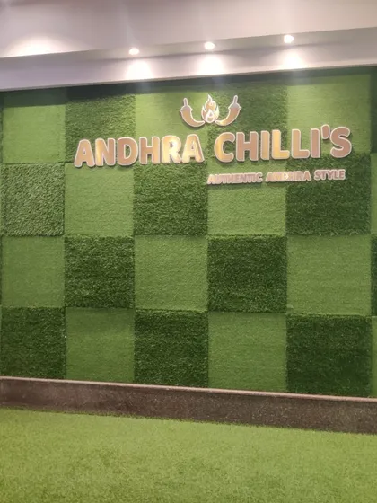 An artificial grass wall designed for the Andhra Chilli's restaurant. The checkerboard pattern using two different turf textures adds a unique, branded touch to their interior.