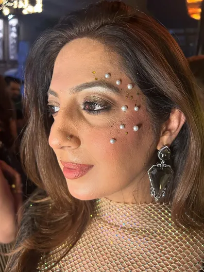 I love using pearls in my designs. They add such a classic and elegant touch. Here, I've combined them with gold glitter for a sophisticated party look.
