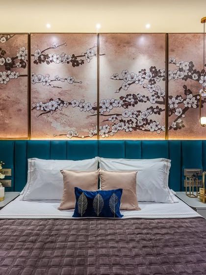 The headboard wall is a great opportunity to make a statement. In this bedroom, we used a beautiful cherry blossom wall panel behind a teal headboard to create a dramatic and artistic focal point.
