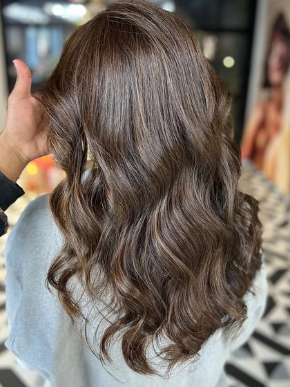 A beautiful, natural-looking brown with subtle highlights and soft waves. Effortlessly chic.
