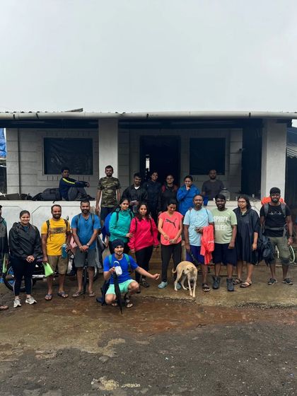 It's a wrap! The group stands for a final photo outside the homestay before heading back.