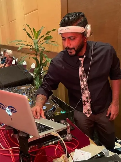 A look at my setup for a corporate or formal event, complete with my laptop and Pioneer controller.