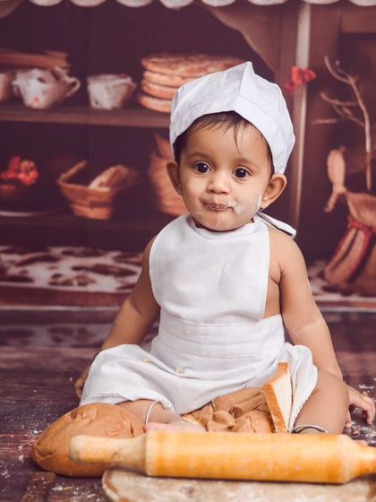 Our little baker is ready to get to work. This chef theme is so much fun, with a tiny apron, hat, and a set full of bread and baking tools.