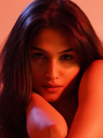 A fierce and moody portrait of model Kashish Kapoor. Using dramatic red lighting and minimal, clean makeup, I focused on enhancing her strong features to create a powerful and intense image.