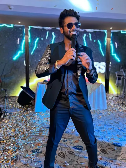 From grand stages to intimate celebrations, I bring the right vibe. Here I am, mid-performance at a sangeet, creating an unforgettable night for the happy couple and their guests.