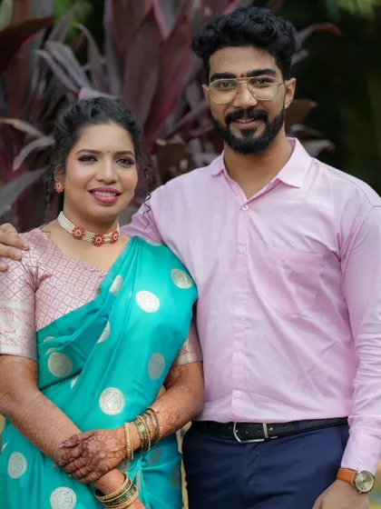 Another shot of the happy couple, their coordinated outfits looking perfect together.