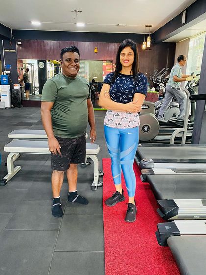 Posing by the treadmills with a client. Every corner of the gym is a place where progress is made.