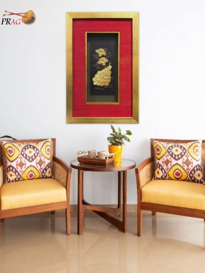 Another view of our framed golden peacock, perfectly complementing a contemporary Indian seating arrangement. The frame turns a decorative object into a piece of high-end interior decor.