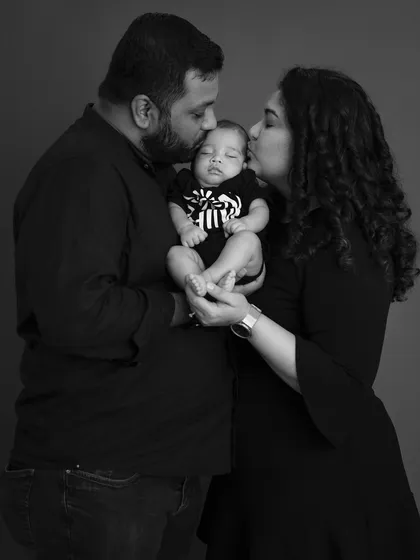 Your first portrait as a new family is a treasure. This classic black and white style focuses on the emotion and connection, creating a timeless image of the love that surrounds your new baby.