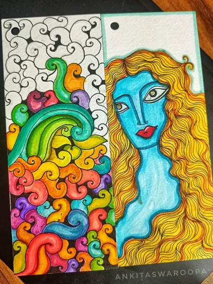 I'm not working on anything big right now, just creating these happy, bright bookmarks. One side features a colorful abstract doodle, while the other has a portrait of a woman, a small piece of my imagination.