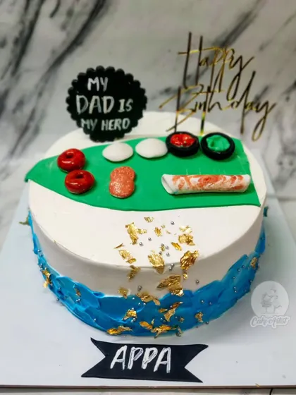 A special cake for a foodie dad! This one features his favorite sushi rolls made from fondant, on a delicious Rasmalai cake.
