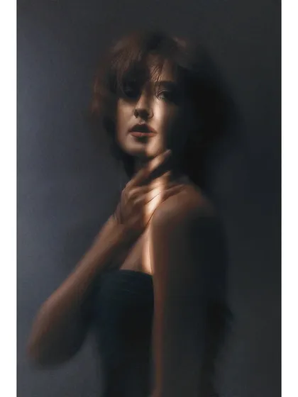 Another artistic portrait from the Sigma shoot. The technique is similar, but the model's pose creates a different mood, showcasing the versatility of a single lighting setup.