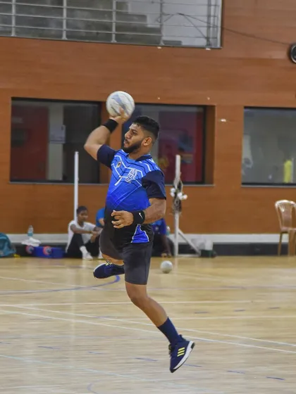 Capturing the peak moment of athletic power. This handball player is frozen mid-air, muscles tensed, right before releasing a powerful shot during a training session for the National Games. This is the kind of explosive action photography I love to shoot.