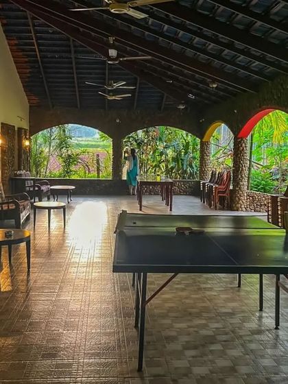 The spacious and relaxing common area of our Chikmagalur homestay, complete with a ping pong table.