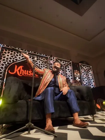 A performer owning the stage at a sangeet night. I capture the entertainment and energy that make your wedding events unique.