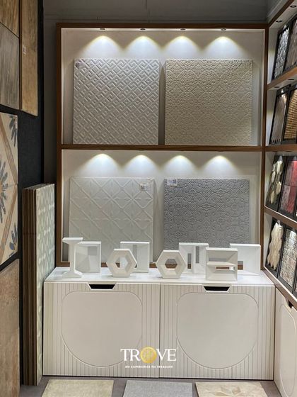 This display showcases a variety of white and neutral textured tiles. The subtle patterns and 3D surfaces demonstrate how you can add depth and interest to a space without overwhelming it with color.