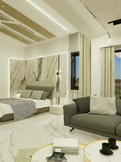 This angle shows the large window and seating area, making the room feel open and connected to the outdoors.
