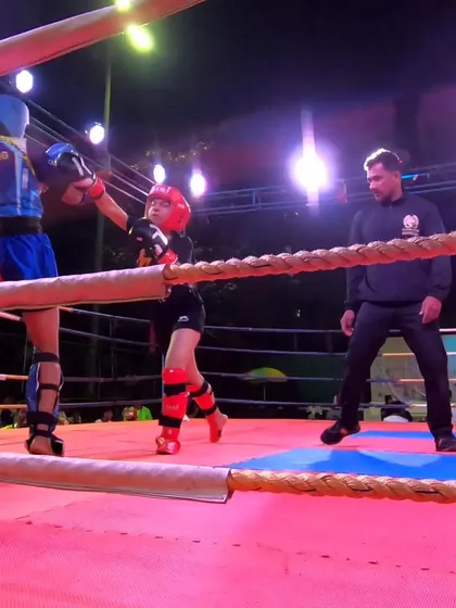 Focus and determination are clear as our fighter advances on her opponent during the national championship bout.