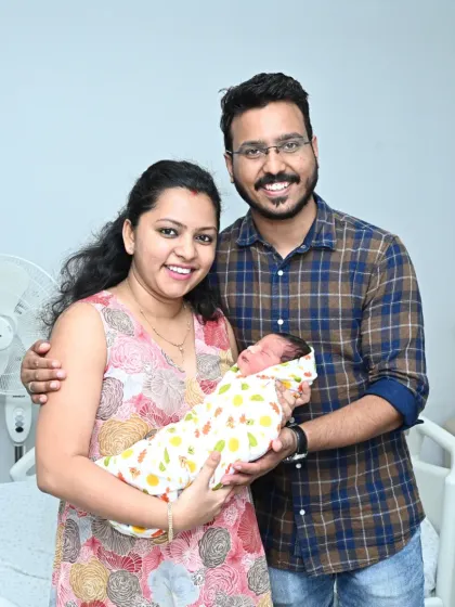 Capturing the pure joy of new parents is one of the best parts of my job. This beautiful portrait was taken right after I set up the family's welcome home celebration, a priceless memory of their first moments together.