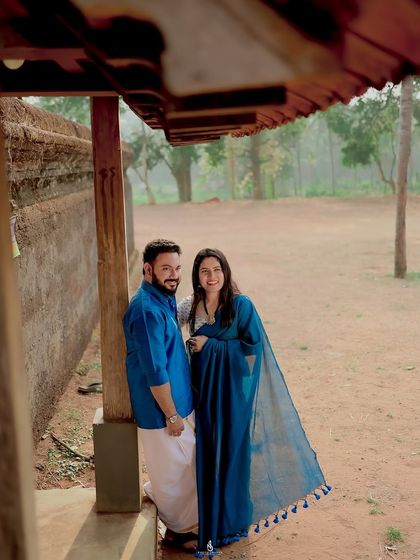 A relaxed portrait on the veranda of a rustic home. This setting provides a unique and culturally rich backdrop for an engagement shoot.