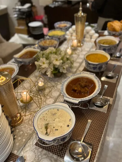 For more formal occasions, I can provide a complete dinner party spread. This setup features an array of Indian main courses served in elegant blue and white dishes, creating a sophisticated dining experience for you and your guests.