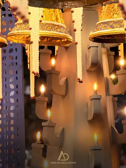 A close-up of the custom wall sconces and hanging bells, showcasing the unique lighting fixtures I designed for this event.