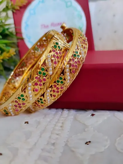 Another angle of the 'Trisha' bangles, showing their slim and elegant profile.