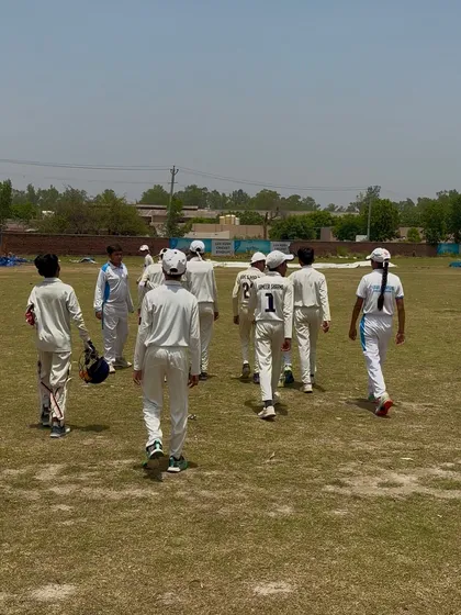 The team walking off the field after a brilliant bowling performance.