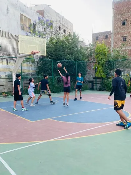 A player takes a shot in the paint, surrounded by defenders. We teach how to stay composed in traffic.