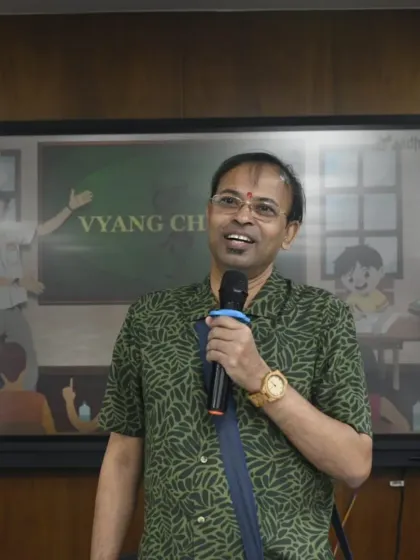 Engaging with the audience is just as important as the art itself. Here I am interacting with students at Parul University during the "Vyang Chitra" cartoon making event, sharing stories and insights from my journey as an artist.