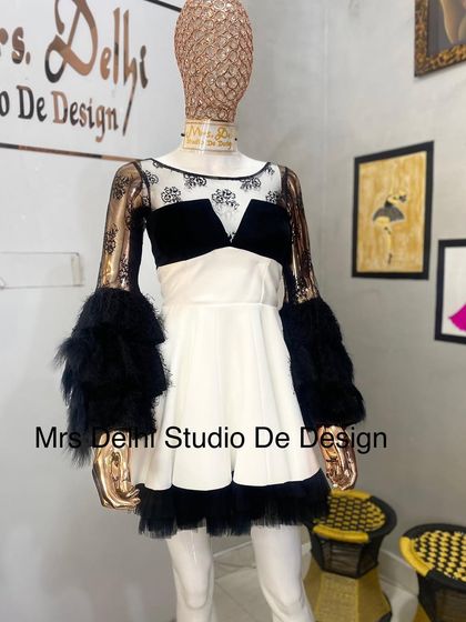 Another look at our custom black and white western dress. The combination of different textures and a bold silhouette makes it a true statement piece.