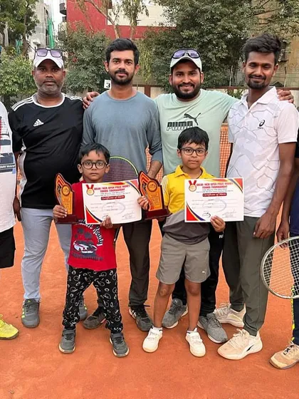 The winning brothers, Adhyant and Adhyayan, with the coaching team. It takes a team effort to produce champions, and we celebrate every victory together.