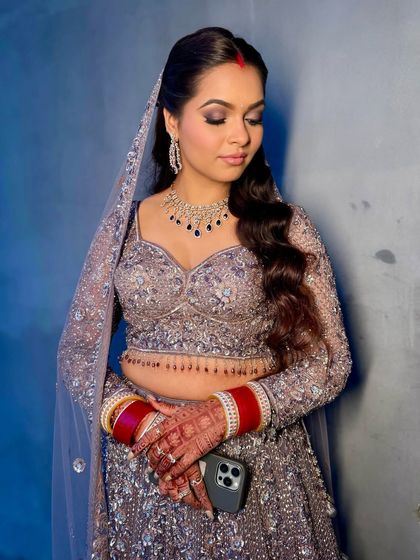 Another angle of the reception glam, showing the beautiful soft waves and the way the makeup enhances her features for the evening.