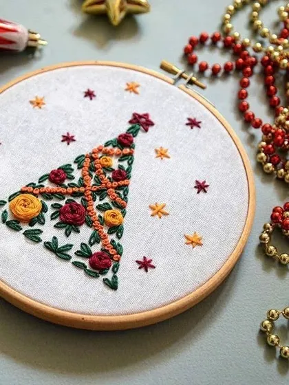 Get cozy with these Christmas-themed embroidery hoops. Featuring snowmen and festive stockings, these handmade pieces add a warm, personal touch to your holiday decor.
