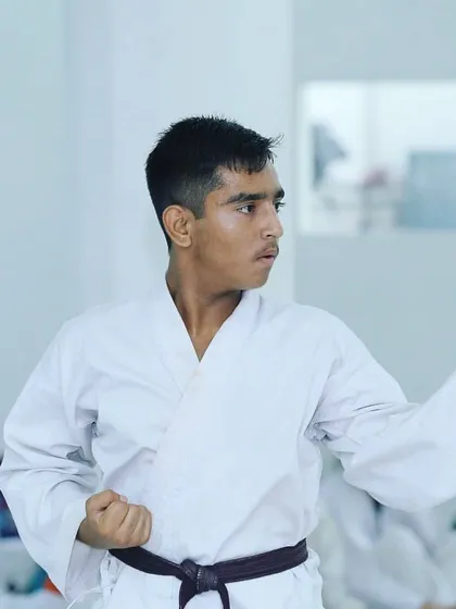 A focused moment during training. Every movement in karate has a purpose, and concentration is key to mastering the art.