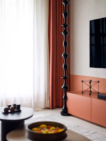 The floor-to-ceiling wooden turning is a bold, modern statement that also nods to traditional South Indian craftsmanship.